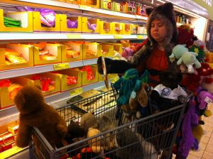 Item #69: You and a friend must take at least 50 of your stuffed animals/dolls on a field trip to a grocery store. (Pictured: my friend Kate)